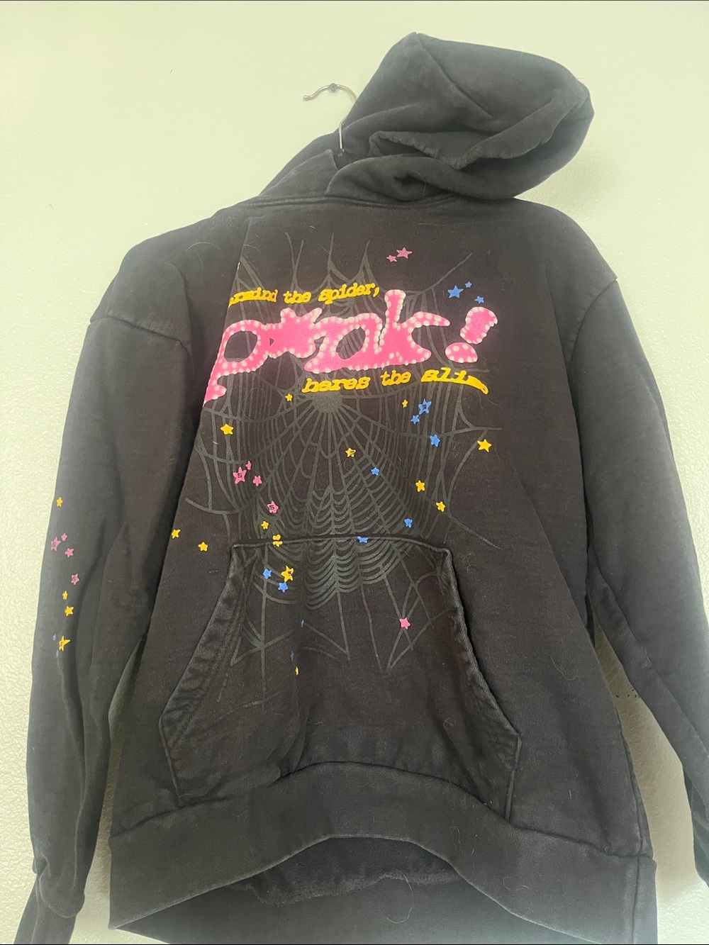 Sp5der Black Graphic Hoodie with Pink Script and Star Accents